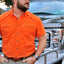 Man wearing blaze s/s performance field shirt in front of truck