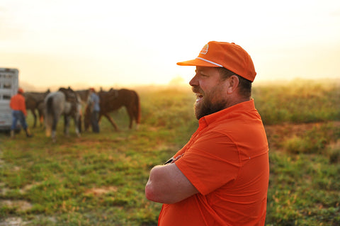 man on ranch wearing s/s blaze performance field shirt and blaze sundown hat