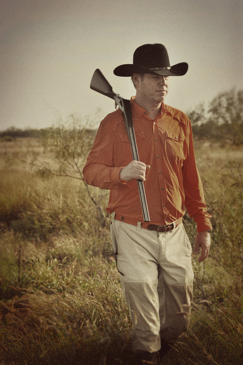 Man walking with gun wearing Long sleeve blaze performance field shirt