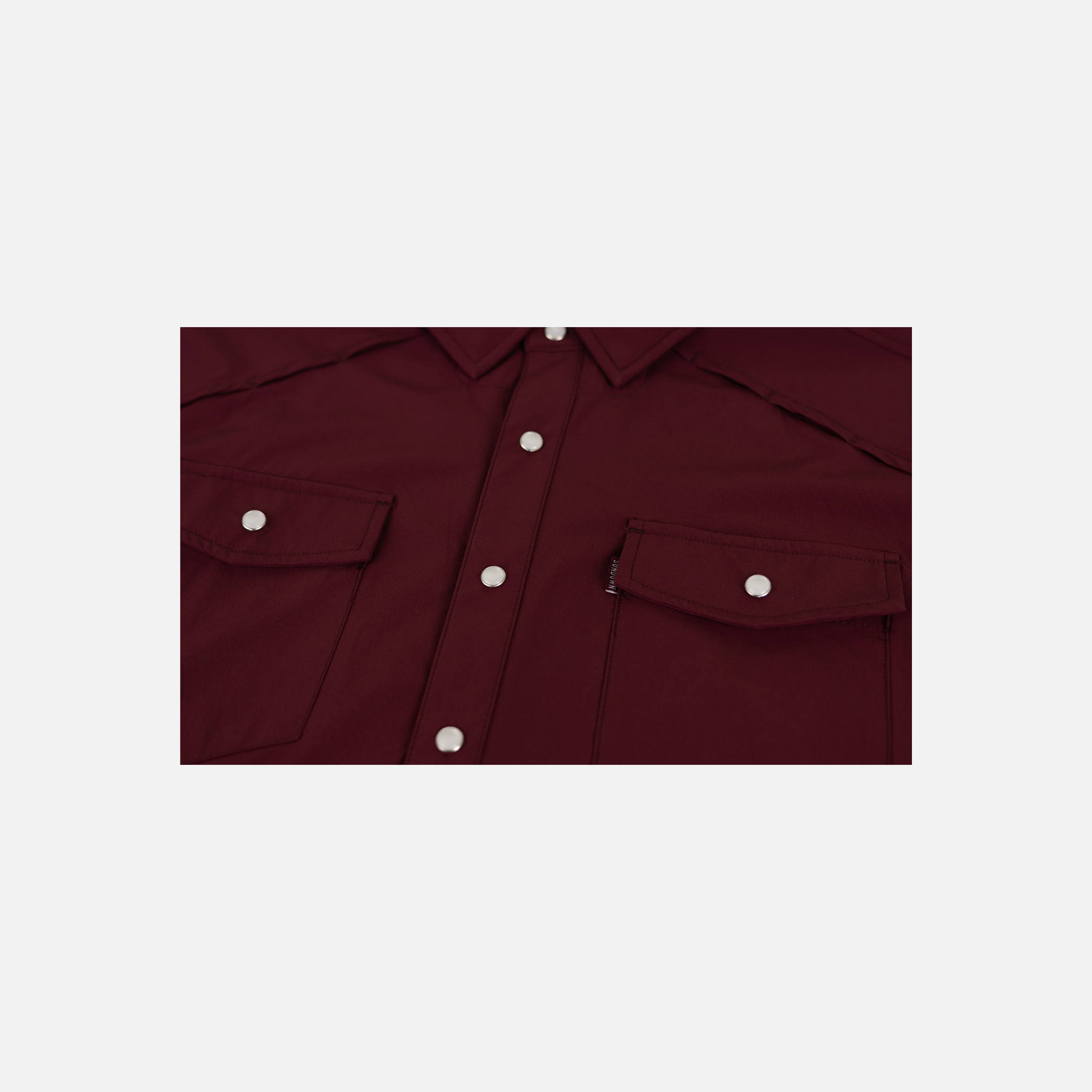 closeup of front buttons and pockets of Maroon Pearl Snap Field Shirt L/S