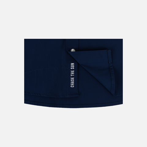 bottom of Navy Pearl Snap Field Shirt S/S showing interior white text inside buttons "CHASE THE SUN"