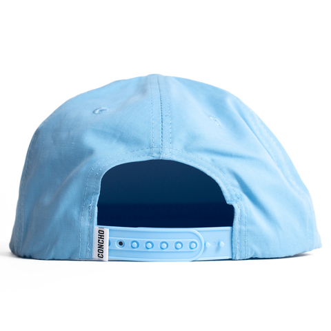 Light blue cap with a dark blue interior on a white background