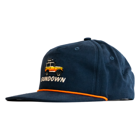 Navy blue cap with embroidered design and 'Sundown' text on a white background