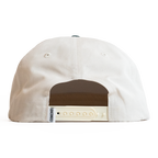 Back view of a beige cap with a brown patch and visible brand logo on a white background