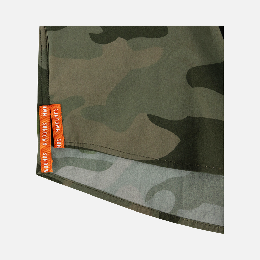 closeup of side seam of Long sleeve Vintage Camo performance field shirt showing text "SUNDOWN"