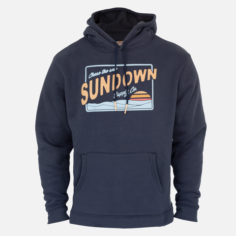 Faded navy heavy weight hoodie with sundown over water graphic on front with text "Chase the sun SUNDOWN Supply co"