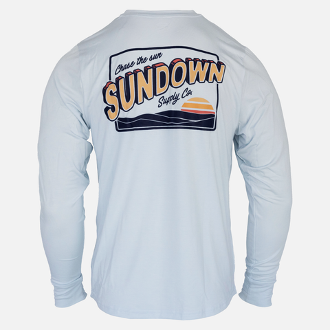 rear view of faded sky l/s bamboo sun crew with sunset over water graphic with text "Chase the sun SUNDOWN Supply co"