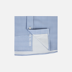 closeup of bottom front of Blue Gingham Pearl Snap Field Shirt L/S showing White "CHASE THE SUN" text inside placket