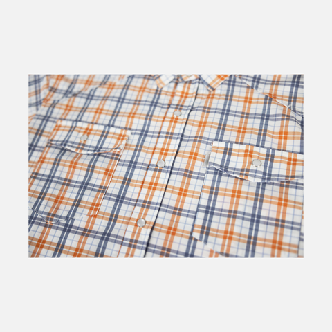 Closeup of front buttons and chest pockets of Orange/Navy Plaid Pearl Snap Field Shirt L/S