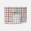 Closeup of bottom front of Orange/Navy Plaid Pearl Snap Field Shirt L/S showing White "CHASE THE SUN" text inside placket- Sundown Supply Co