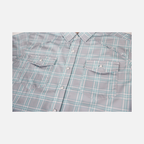 Closeup of front buttons and chest pockets of Seafoam/Grey Plaid Pearl Snap Field Shirt L/S