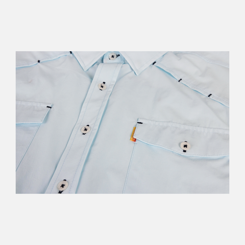 closeup of buttons and front pockets on chest of faded sky s/s performance field shirt