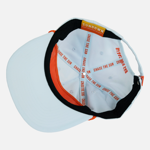 Upside down view of Faded Sky Unstructured 5-Panel Rope Cap showing "CHASE THE SUN" orange text interior taping