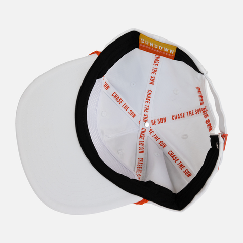 upside down view of white unstructured 5-panel rope cap with interior taping with text "CHASE THE SUN"