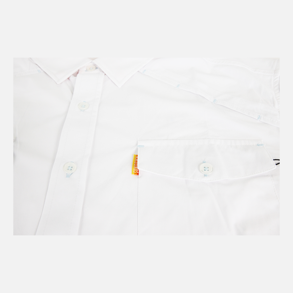 closeup of front pocket of White performance field shirt long sleeve showing orange sundown label on pocket - Sundown Supply Co