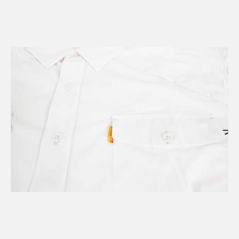 closeup of front pocket of White performance field shirt long sleeve showing orange sundown label on pocket